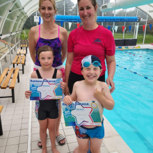 George and Arla with their swimming awards.